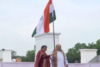 Home Minister Amit Shah hoisted the tricolor at his residence with his wife