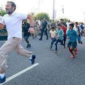 Rahul runs with school students on the fifth day of Bharat Jodo Yatra in Telangana
