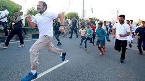 Rahul runs with school students on the fifth day of Bharat Jodo Yatra in Telangana