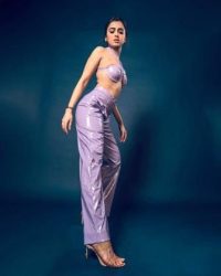 Actress Tejashwi Prakash gave a very stylish pose wearing a purple bralette with pants