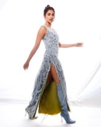 Pooja Hegde flaunts toned figure wearing denim boots, long revealing kurti