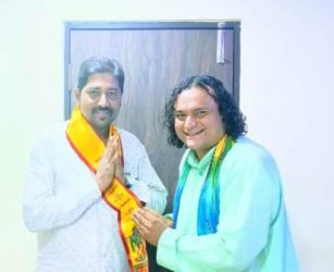 Prophet Pandit Ravindra Acharya felicitated Dr Krishna Chauhan