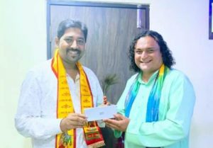 Prophet Pandit Ravindra Acharya felicitated Dr Krishna Chauhan