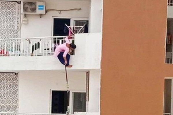 Maid hanged from 12th floor balcony when owner's handkerchief fell, photo surfaced